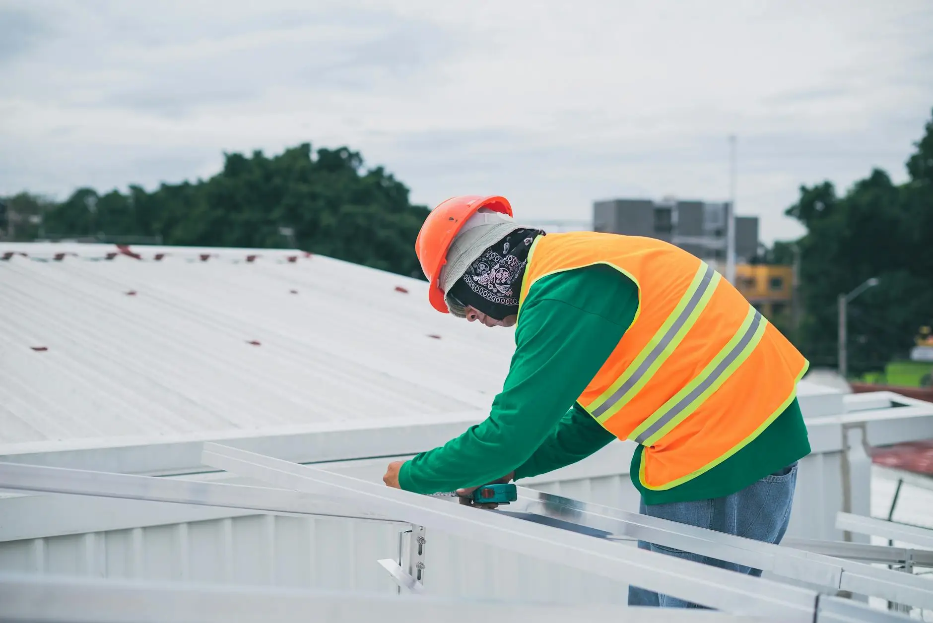 A professional roofing team installing high-quality asphalt shingles on a Newton home.
